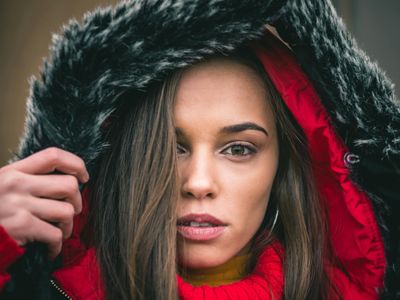 Close up of a person looking into the distance thoughtfully