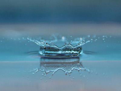 Crystal clear water drops on a glass surface